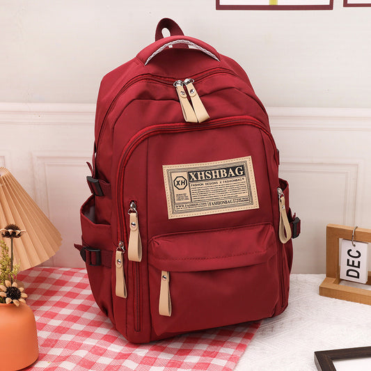 Burgundy outing and student backpack